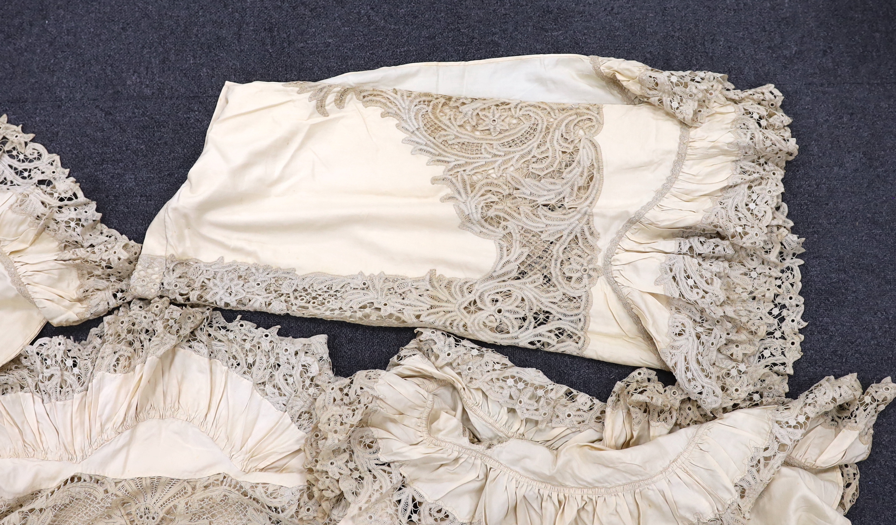 One long cream silk curtain decorated with tape lace insertions and frilled border, 226cm long x 134cm wide, together with three small curtains, 135cm x 74cm deep
